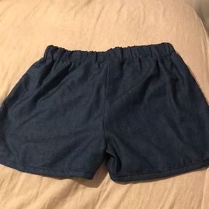 A 3 piece shirt and short and over all